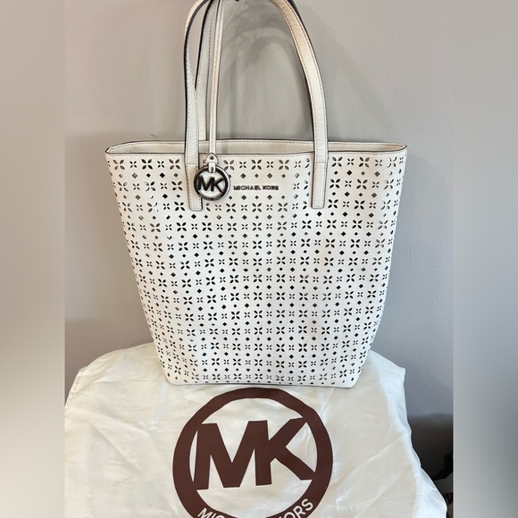 Michael Kors Handbags - Michael Kors White Perforated Tote Bag with Signature Charm